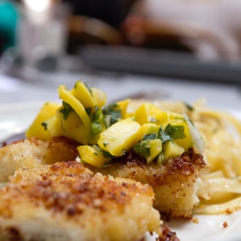 Catalina Food Tours - Lobster Trap - Battered Halibut topped with mango, jalapeño, cilantro salsa next to a bed of fettuccine. - Food Tours Near Me - Avalon, California