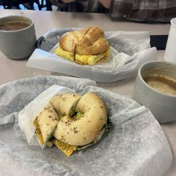 Veggie bagel and avocado added and the egg cheese bagel