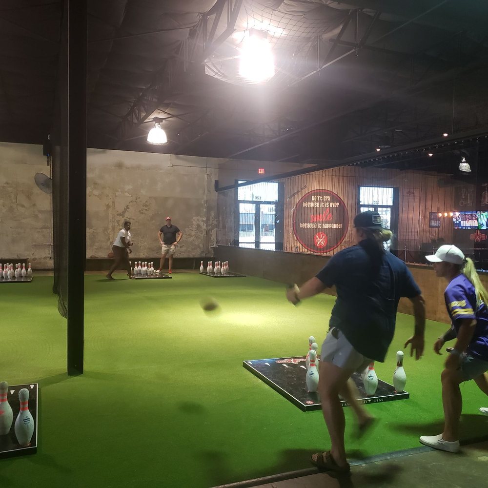 Pin toss- throw the football to knock down the pins. Very family friendly.