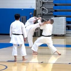 JKA of San Francisco Bay - JKA of SF Bay Chief Instructor T.J. Stiles, kicking at left, during a rank examination.