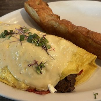 Bistro Cafe - Cristobal Omelette- has churrasco, cantimpalo and goat cheese.  It's so good - Breakfast & Brunch Near Me - Miami, Florida