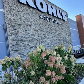 Kohl's - The image shows the exterior of a Kohl's store with a stone wall facade, signage for Kohl's and Sephora, and landscaped flowers in front. - Department Stores Near Me - Morton Grove, Illinois