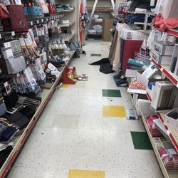 Family Dollar - Bathroom area with a ladder open and no one around it. Safety hazard!