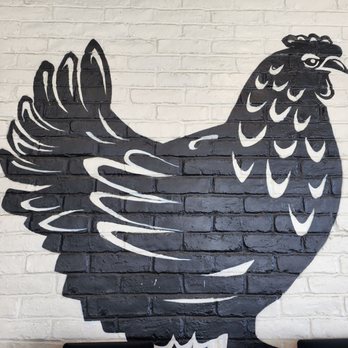 Saucy Chick Indi-Mex Eatery - a chicken painted on a brick wall - Indian Near Me - Pasadena, California