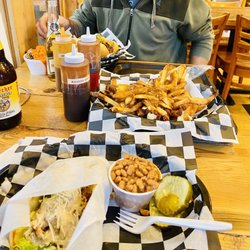 Bad Bones BBQ - Poutine, Bomber Sandwich, Buffalo Mac and Cheese, and Chicken Caeser Pita.