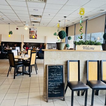 Mr. Breakfast - a woman sitting at a table in a restaurant - Breakfast & Brunch Near Me - Hoffman Estates, Illinois