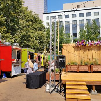 Midtown Beer Garden - food trucks parked in a parking lot - Beer, Wine & Spirits Near Me - Portland, Oregon
