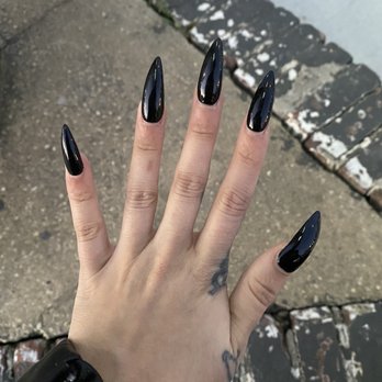 Lucy's Nail Boutique - Full set stiletto acrylics.black gel polish. One week old - Nail Salons Near Me - New York, New York