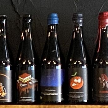 Orchestrated Minds Brewing - a row of bottles of wine - Breweries Near Me - Fort Lauderdale, Florida Orchestrated Minds Brewing - a row of bottles of wine - Breweries Near Me - Fort Lauderdale, Florida