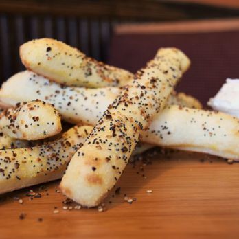 Cottage Inn Pizza - a pile of breadsticks on a table - Pizza Near Me - Madison Heights, Michigan Cottage Inn Pizza - a pile of breadsticks on a table - Pizza Near Me - Madison Heights, Michigan