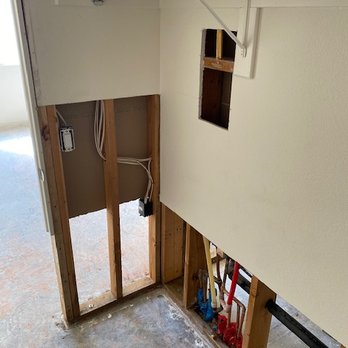 Express Dry Restoration - Walk-in closet with hot water pipe that leaked shown rerouted (red). - Damage Restoration Near Me - Escondido, California Express Dry Restoration - Walk-in closet with hot water pipe that leaked shown rerouted (red). - Damage Restoration Near Me - Escondido, California