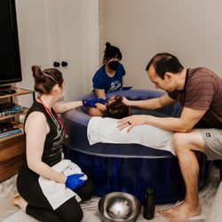 East Bay Midwives - Jeannie and Amanda supporting the active labor stage in the tub. Best team ever!