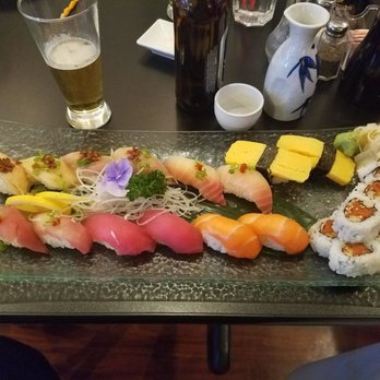 Koji Sushi - Sushi Deluxe with Tomago Nigiri added.  Small sake and Sapporo beer. - Sushi Bars Near Me - McKinney, Texas