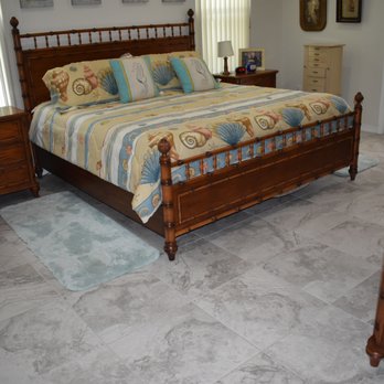 Tile And Carpet World - a bed in a bedroom - Flooring Near Me - Port Charlotte, Florida Tile And Carpet World - a bed in a bedroom - Flooring Near Me - Port Charlotte, Florida
