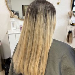 Uneven tone from previous blonding sessions.