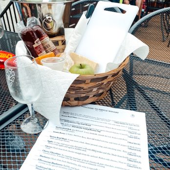 Pirtle Winery - a basket of food on a table - Wineries Near Me - Weston, Missouri Pirtle Winery - a basket of food on a table - Wineries Near Me - Weston, Missouri