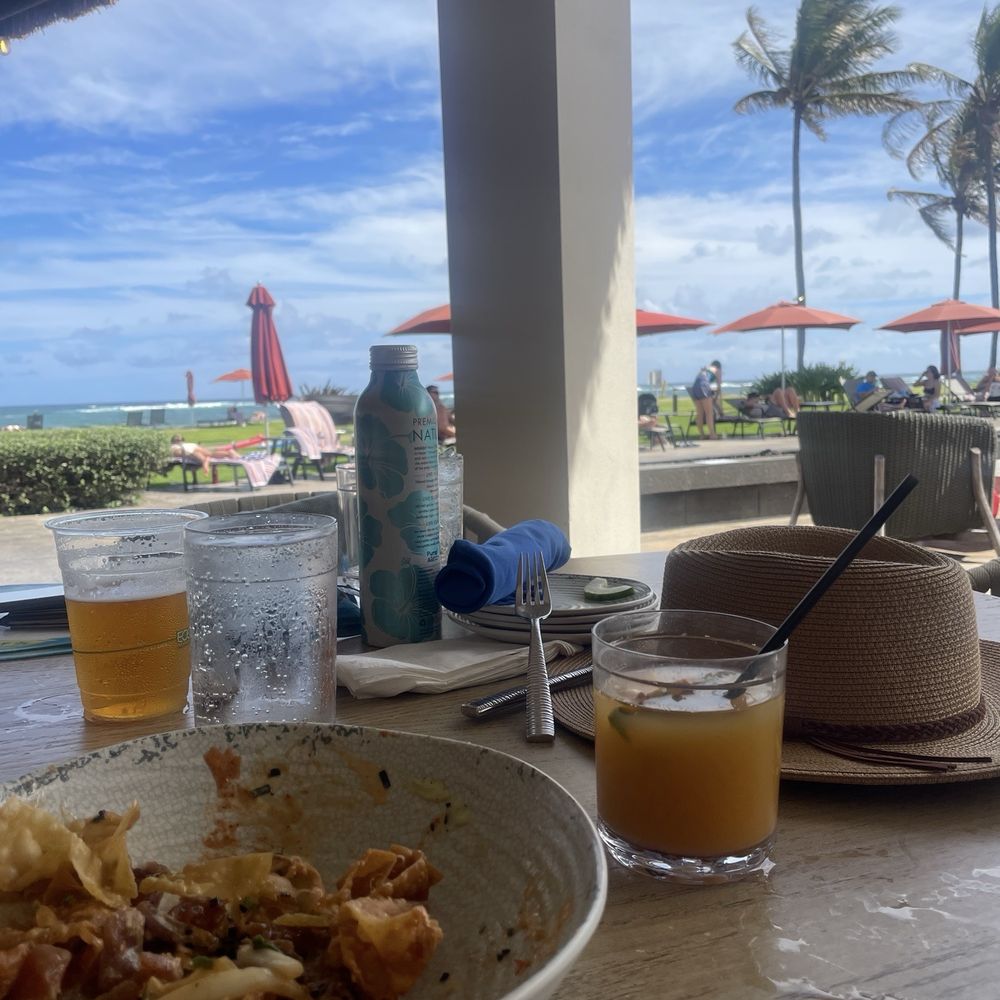 The Crooked Surf - Mai Tai and a view (ahi poke nachos to the left) - Cocktail Bars Near Me - Kapaa, Hawaii The Crooked Surf - Mai Tai and a view (ahi poke nachos to the left) - Cocktail Bars Near Me - Kapaa, Hawaii