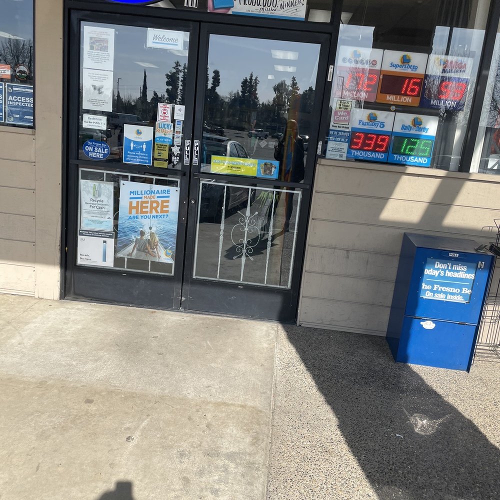 Broadway Liquor - a shadow of a person on the sidewalk - Beer, Wine & Spirits Near Me - Fresno, California