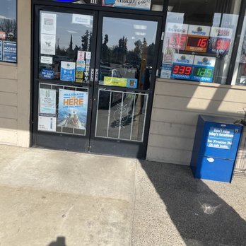 Broadway Liquor - a shadow of a person on the sidewalk - Beer, Wine & Spirits Near Me - Fresno, California