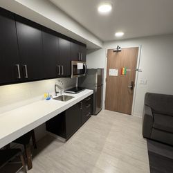 University Guest House & Conference Center - Kitchenette portion of the suite.