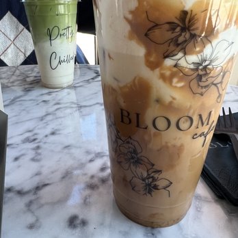Bloom Cafe - back: iced matcha front: lotus biscoff latte - Coffee & Tea Near Me - Garland, Texas