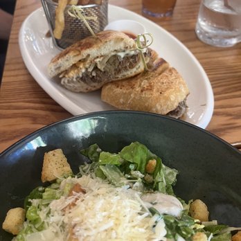 Limonada Bar + Brunch - Short rib sandwich and Caesar salad - Breakfast & Brunch Near Me - Miami Beach, Florida Limonada Bar + Brunch - Short rib sandwich and Caesar salad - Breakfast & Brunch Near Me - Miami Beach, Florida