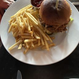 Fried chicken thigh sandwich with fries Fried chicken thigh sandwich with fries