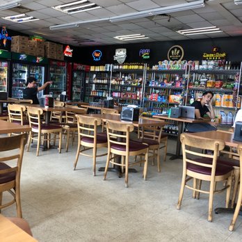 Wholly Cow - Seating area and shop - Burgers Near Me - Austin, Texas Wholly Cow - Seating area and shop - Burgers Near Me - Austin, Texas