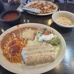 Marias Restaurant - Arroz con pollo (requested extra serving) & shredded beef chimichanga (dips: salsa and queso blanco with chorizo)
