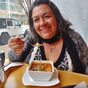 Thai Gai Yang Cafe - My friend Maria enjoying the spicy thai soup! - Thai Near Me - Saint Louis, Missouri Thai Gai Yang Cafe - My friend Maria enjoying the spicy thai soup! - Thai Near Me - Saint Louis, Missouri