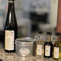 Drizzles - 25 Star Balsamic vinegar, Papua New Guinea coffee, sweet balsamic vinegar samplers (White peach & blackberry) and Italian herb olive oil.