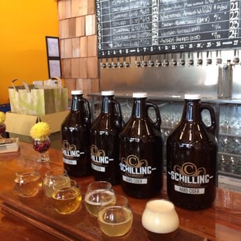 Schilling Cider House - Flight with growlers in the background! - Bars Near Me - Seattle, Washington