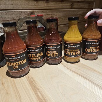 The Smoke Pit - Sauces on table - Southern Near Me - Charlotte, North Carolina The Smoke Pit - Sauces on table - Southern Near Me - Charlotte, North Carolina