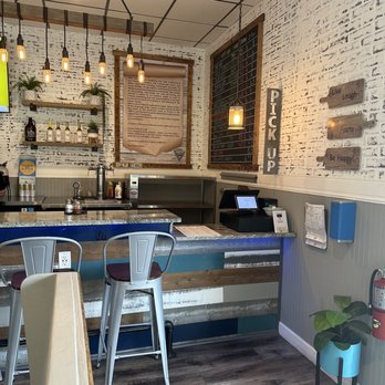 Calusa Pizza & Craft - Edison lights give the small bar and takeout counter a warm vibe - Pizza Near Me - Lutz, Florida Calusa Pizza & Craft - Edison lights give the small bar and takeout counter a warm vibe - Pizza Near Me - Lutz, Florida
