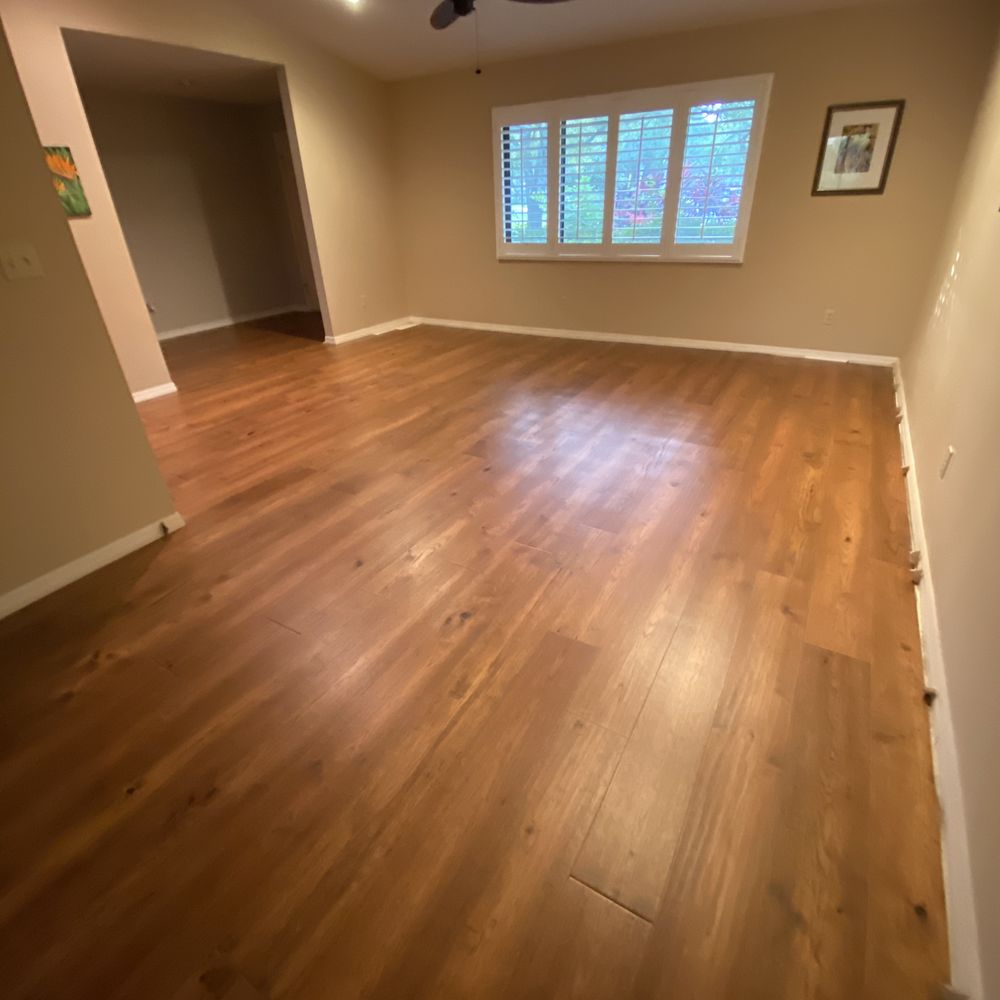 a hardwood floor in an empty room a hardwood floor in an empty room