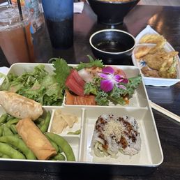 Spicy Kanaka ramen (back), tempura with sauce (middle), nigiri bento box