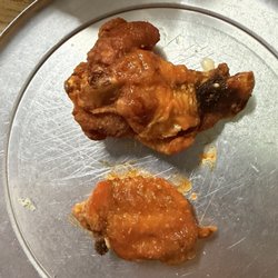 Wing Central - That same tiny wing next to a "regular" size wing.