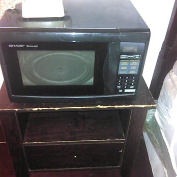 Senton Hotel - The microwave on top of damaged dresser - Hotels Near Me - New York, New York Senton Hotel - The microwave on top of damaged dresser - Hotels Near Me - New York, New York