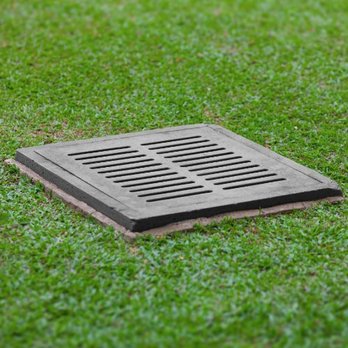 Cheap Georgia Mulch - a drain in the grass - Landscaping Near Me - Cumming, Georgia Cheap Georgia Mulch - a drain in the grass - Landscaping Near Me - Cumming, Georgia