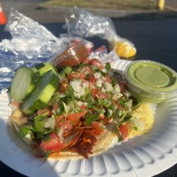 Leo’s Tacos Truck - 2 tacos de Al pastor topped with pico de gallo and avocado salsa