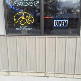 The Outfield - a window with a neon sign and a fire hydrant - Sports Bars Near Me - Richland, Iowa The Outfield - a window with a neon sign and a fire hydrant - Sports Bars Near Me - Richland, Iowa
