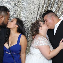 Capture Entertainment - Newlyweds enjoying our classic open-air photo booth at their Southern California wedding reception.