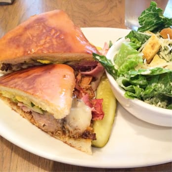 Colossal Cafe - The Cubano sandwich with Caesar salad side at Colossal Café - American Near Me - Saint Paul, Minnesota Colossal Cafe - The Cubano sandwich with Caesar salad side at Colossal Café - American Near Me - Saint Paul, Minnesota