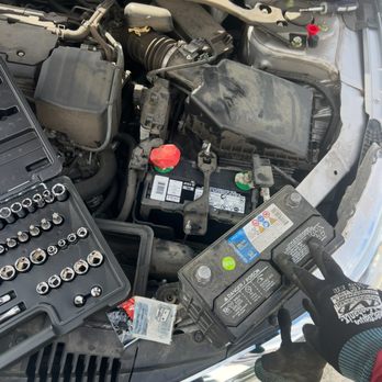 Zee Towing - Replacing a car battery on-site for a customer in need. - Roadside Assistance Near Me Zee Towing - Replacing a car battery on-site for a customer in need. - Roadside Assistance Near Me