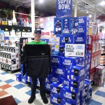Liberty Bell Beverage - a man holding a laptop in a store - Beer, Wine & Spirits Near Me - Allentown, Pennsylvania Liberty Bell Beverage - a man holding a laptop in a store - Beer, Wine & Spirits Near Me - Allentown, Pennsylvania