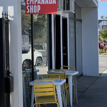 The Empanada Shop - yellow chairs and tables outside - Empanadas Near Me - Redondo Beach, California