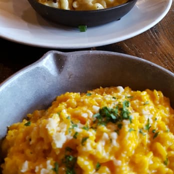 FINKA Table & Tap - Pumpkin risotto  (foreground), and appetizer size of mac-and-cheese topped with protein. - Asian Fusion Near Me - Miami, Florida