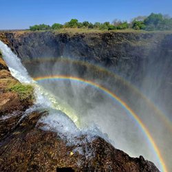 Sunny Cool Breeze Travel - Tabletop mountain and rainbow in Africa.