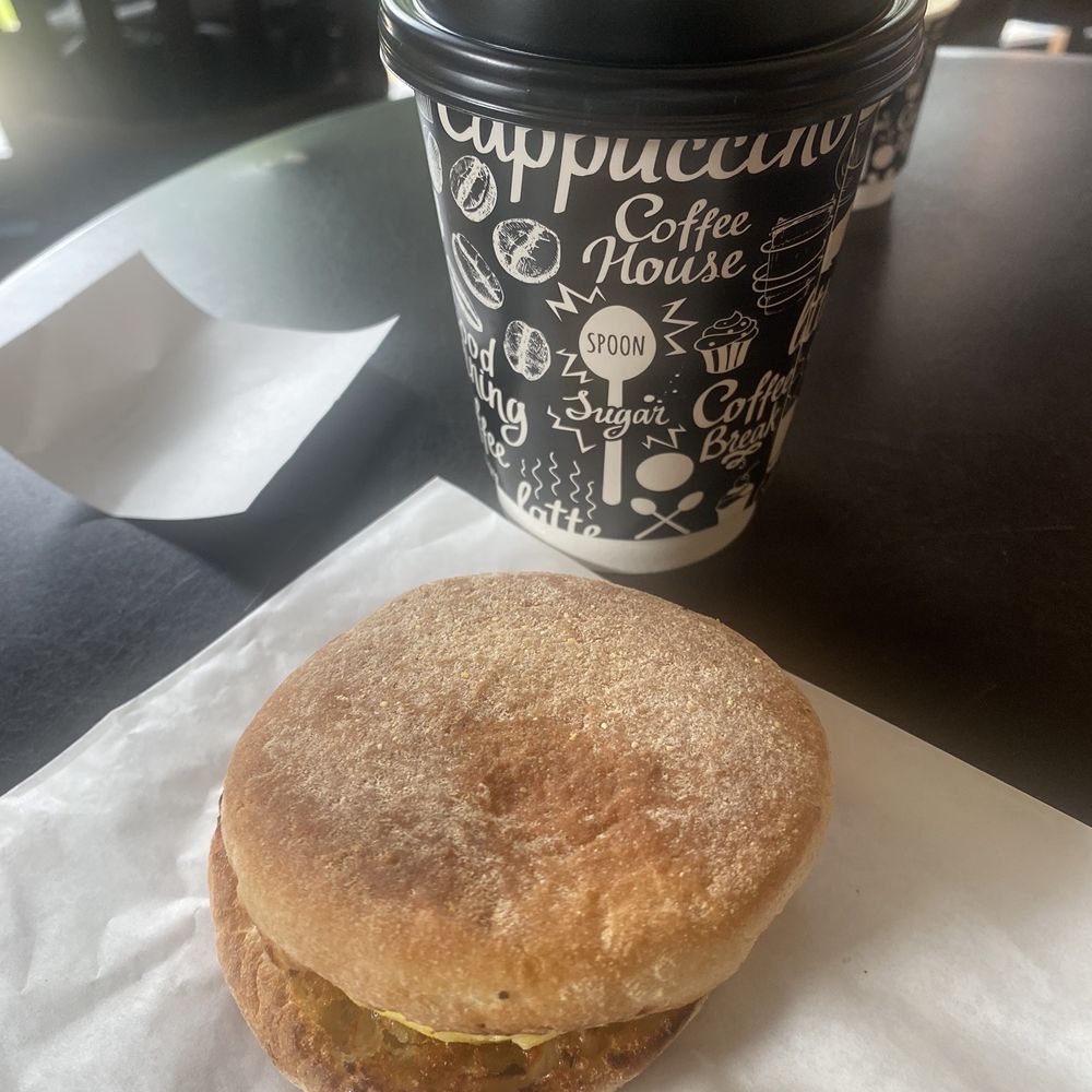 Bacon egg on English muffin with a coffee. Bacon egg on English muffin with a coffee.