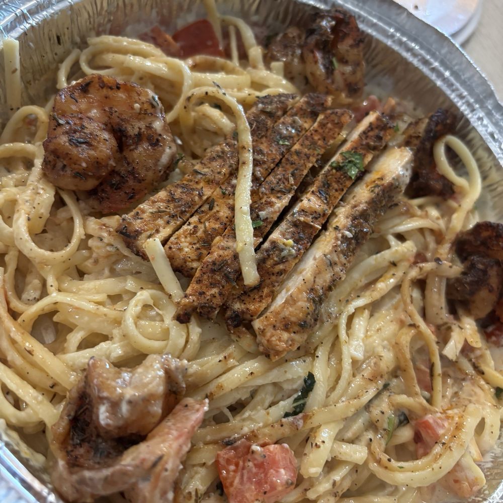 Goodfellas Pizzeria - Blackened shrimp Alfredo with blackened chicken added. The chicken was already halfway eaten when this pic was taken. - Pizza Near Me - Sanford, Florida Goodfellas Pizzeria - Blackened shrimp Alfredo with blackened chicken added. The chicken was already halfway eaten when this pic was taken. - Pizza Near Me - Sanford, Florida